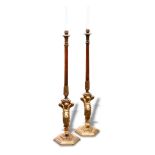 A pair of 20th century ormolu floor standing lamps, the turned wood columns raised on ormolu putto