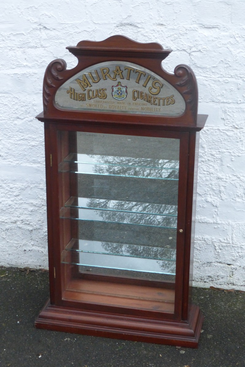 A Muratti's High Class Cigarettes wall mounted dispensing cabinet by O.C. Hawkes Ltd, with
