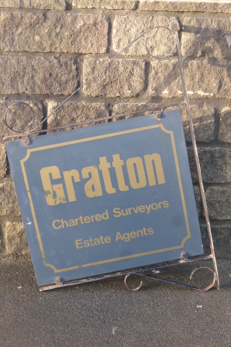 A double sided advertising sign on a metal wall bracket, promoting Gratton Chartered Surveyors and - Image 2 of 2