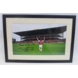 An autographed photograph signed by the Arsenal captain Tony Adams.