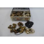 A box of assorted military regimental buttons including the Wiltshire Regiment, The Royal Marines,