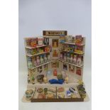A good miniature shop display "McGregor's " with various small packets and products.