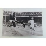 An autographed photograph signed by the great Portuguese footballer EUSE BIO.