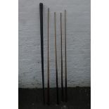 Four assorted snooker cues including a cased Orme & Sons Manchester.