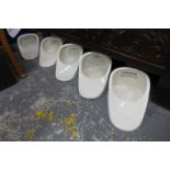 A collection of bed pans, feeders, slipper pans etc.