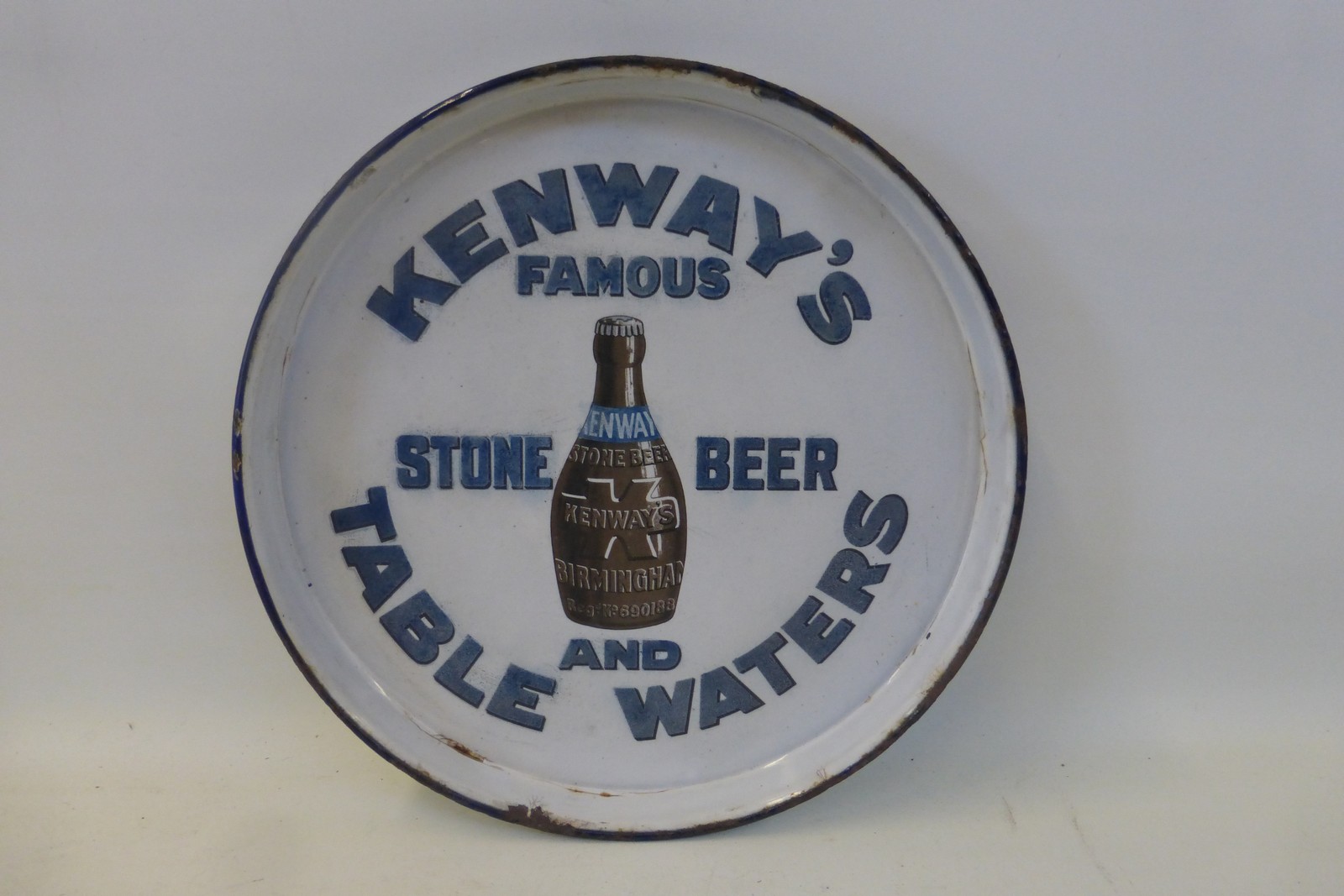 A Kenway's Famous Stone Beer Table Waters part pictorial enamel circular tray, 11 1/2" diameter.