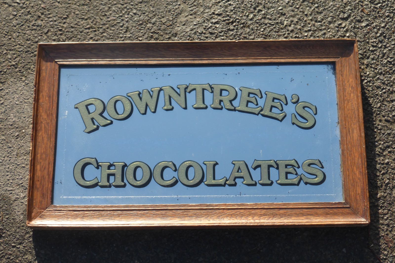 A Rowntree's Chocolates rectangular advertising mirror set within an oak frame, 19 1/2 x 11 1/4".
