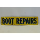 A rectangular blue and yellow enamel sign "Boot Repairs", with good gloss, 46 3/4 x 10 1/4".