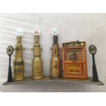 A set of Tipp & Co. tinplate petrol pumps, three pumps with glass globes for Pratts, Shell and BP,