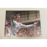 An autographed photograph signed by the Spurs legend Teddy Sheringham.