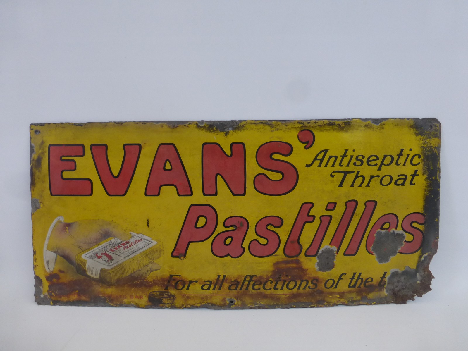 An Evans' Antiseptic Throat Pastilles part pictorial enamel sign, 24 x 11".