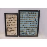 Two display boards mounted with 234 military cap badges/lapel badges, of assorted ages and