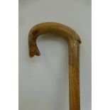 A horn handled walking stick carved in the form of a trout.