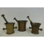 Three 19th Century brass pestles and mortars.