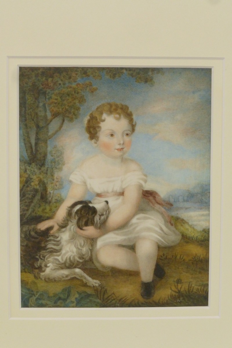 A finely detailed 19th Century painting on ivory depicting an angelic child with dog seated on a
