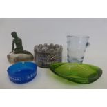 An assortment of brewery related items including ashtrays, a Carlsberg figure etc.