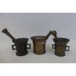 Three early 19th Century brass pestles and mortars.