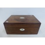 A 19th Century rosewood work box inlaid with mother of pearl.