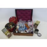 A mahogany cased work box with sewing accessories including silver thimbles and a quantity of