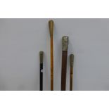 Part of a military riding crop and three swagger sticks.