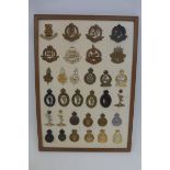 A framed display of thirty-two military badges.