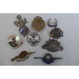 Ten WW1 sweetheart brooches and lapel badges including silver.