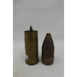 A WW1 trench art table lighter made from an inert German shell dated 1916.