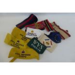 Five British Army stable belts and seven arm bands including Civil Defence Corps Headquarters &