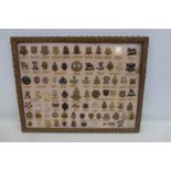 A framed display of 83 British military cap badges mainly O.T.C. Officer Training Corps.