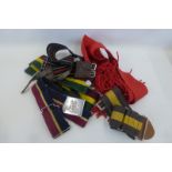 Four British Army stable belts and a sash.