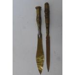 Two WW1 trench art paper knives, one having the French Croix de Guerre.