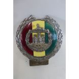 A chrome and enamel car badge made by J.R. Gaunt to the Dorsetshire Regiment.