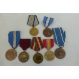 Three UN medals with two Russian medals and two American medals.