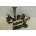 Seven assorted military torches.