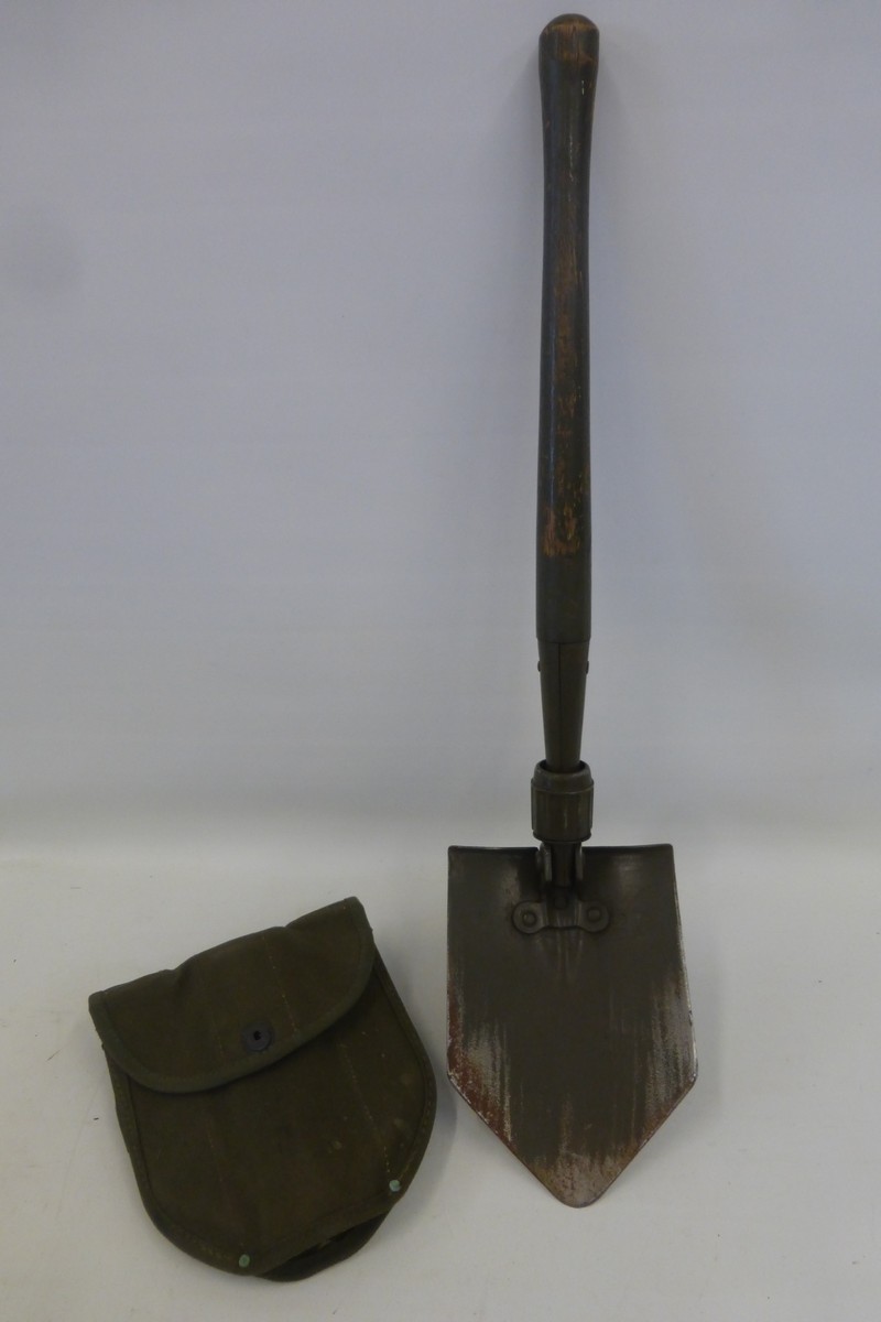 A 1945 dated U.S. Army entrenching tool made by Wood, in its case.