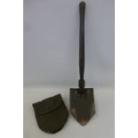 A 1945 dated U.S. Army entrenching tool made by Wood, in its case.