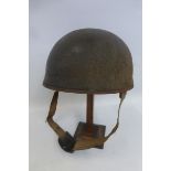 An undated WW2 style British Paratrooper's or Despatch Rider's helmet with liner and chin strap.