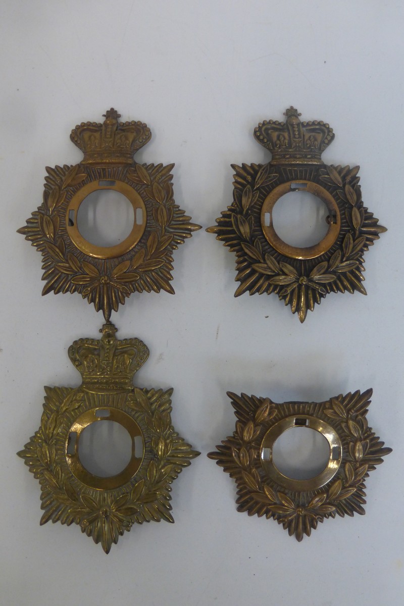 Four Victorian helmet plates, one A/F.