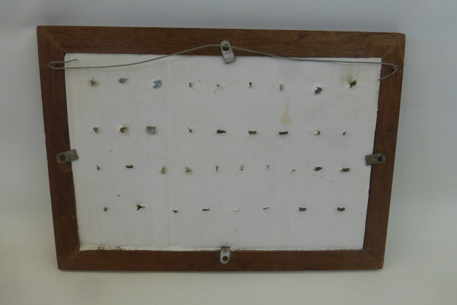 A framed display of metal detector finds of thirty-six military buttons. - Image 2 of 2