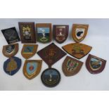 A collection of 14 military wall shields including 3rd Carabiniers, E.O.L.C, 4th Armoured Brigade,