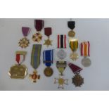 Twelve reproduction medals.