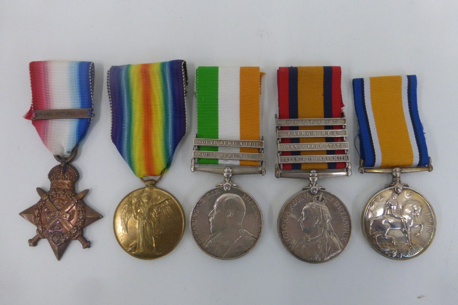 A Boer War and WW1 medal group to an officer in the 19th Hussars consisting of QSA with four