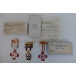 Three British Red Cross Nursing Medals with paperwork and boxes awarded to Miss Marjorie Brewer.