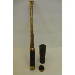 An AITCHISON LONDON, three drawer leather clad brass military pocket telescope.