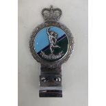 A chrome and enamel car badge made by J.R. Gaunt to the Royal Corps of Signals.