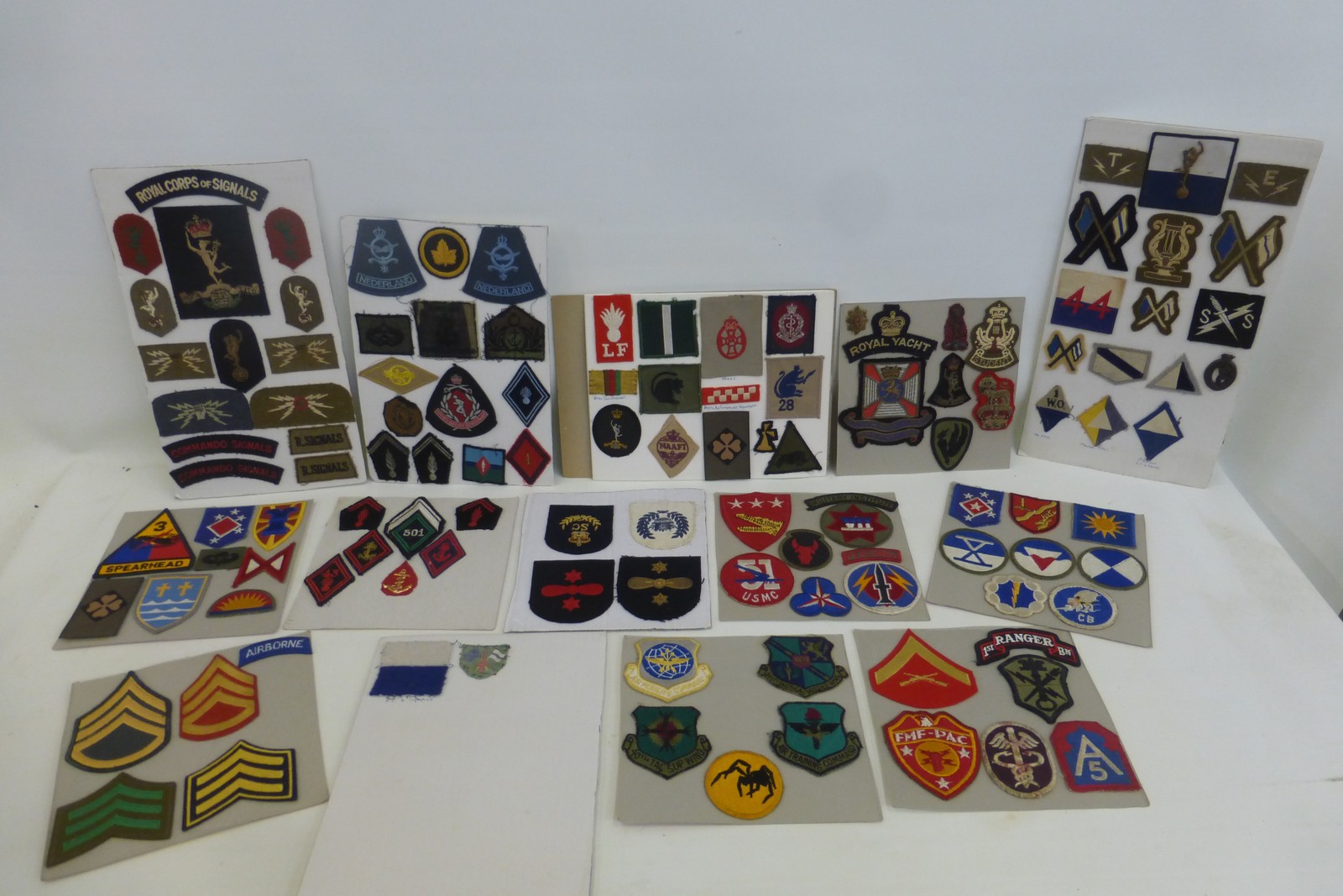 A large quantity of military cloth badges.