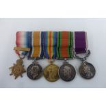 A mounted WW1 and WW2 group of miniature medals including the Mons Star with clasp and the L.S.G.