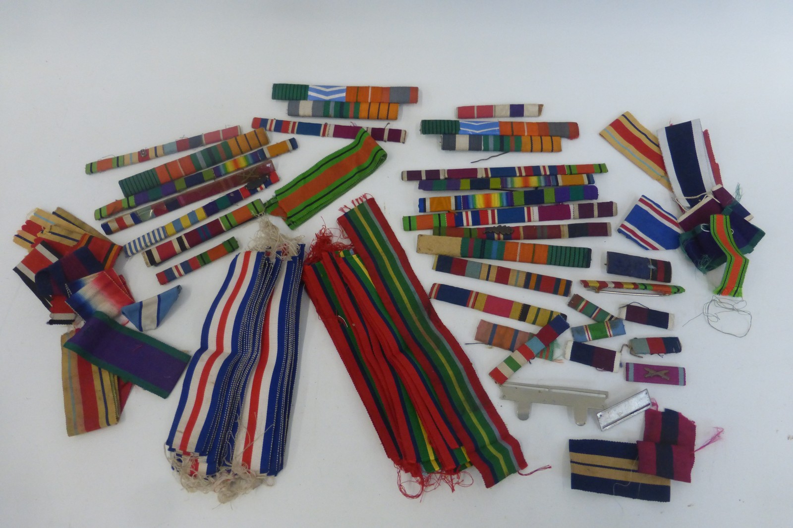 A box of assorted ribbon bars with a quantity of France and Germany Star ribbons and Pacific Star
