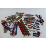 A box of assorted ribbon bars with a quantity of France and Germany Star ribbons and Pacific Star