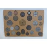 A card of assorted medallions including military.